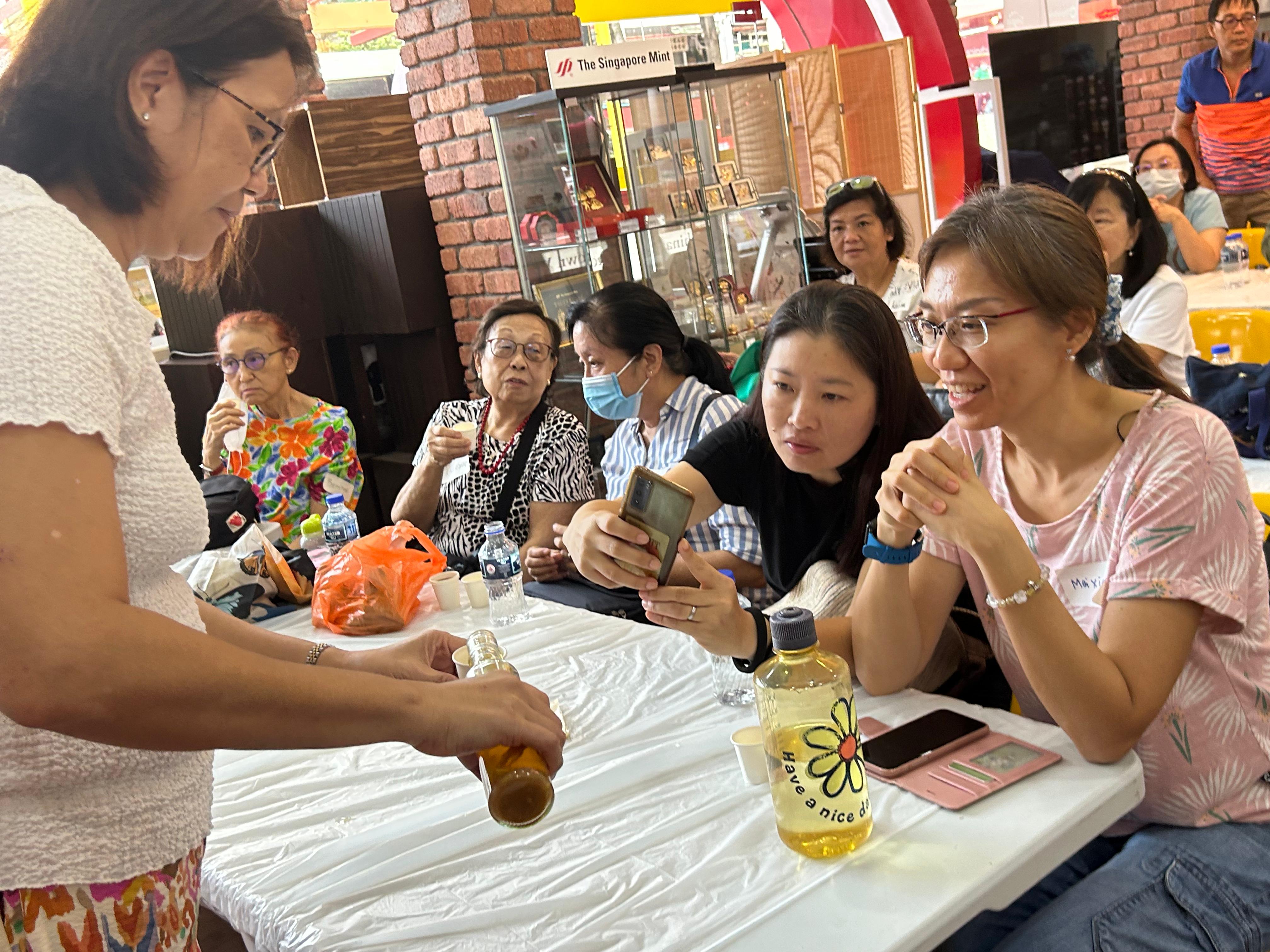 group of students tasting rice wine