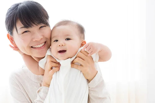 happy asian mom and baby